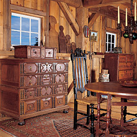 A Boston chest with split spindles is located along the southeast wall of the barn. Serving a dual purpose, it is visually striking as well as being a repository within the drawers for small early hand mirrors, watercolors, and wooden tools and implements.