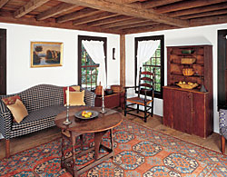 The couple built the tea house based on a eighteenth-century design and techniques, and then filled it with period furniture and accessories. The butterfly drop-leaf table in the tea house is set with pewter from the couple's large collection.