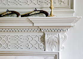 Fig. 9: The fine carving on this cypress mantel and overmantel in the John Fullerton House is in the second-floor drawing room, the most formal space for entertaining. Charleston was blessed with an influx of highly skilled craftspeople in the eighteenth century, all of whom contributed to the rich legacy of architecture, interior finishes, and decorative arts. Photography by Carrie Naas.