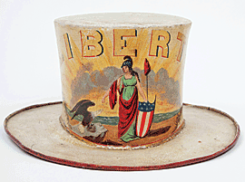 Fig. 5: Fireman’s parade hat for the Liberty Company, containing labels of hatmaker Joshua Van Sant, and painter Geo. J. Roche and Son. Baltimore, 1820–1835. Painted pressed felt. H. 6-1/2, Diam. Brim 12 in.  