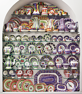 Displayed on recessed glass shelves, rainbow spatterware creates a symphony of color in the main first floor entry; each piece plays its part in orchestrating color cords. Dennis first discovered spatterware at Pennypacker’s auctions near Reading, Pennsylvania, when he was a teenager collecting Historical Blue Staffordshire. “A friend of my mother’s collected spatter and I would buy some for her at auctions, and when she didn’t want what I bought, I kept it,” he said. His collection, which fills three alcoves, is exclusively rainbow spatter, four- and five-color stripes, festoons, pinwheel, and bull’s eye patterns on full and child size tableware. This collection is complete; when something comes in something must go out.