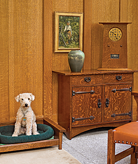 Wynn, the resident Lakeland terrier, has her own Arts and Crafts-style bed in the master bedroom in the new glass wing. The Rookwood vase, decorated by Louise Abel Barrett in 1924, is on a cabinet by Gustav Stickley. The painting of a boy picking berries is by Philadelphia artist Violet Oakley (1874–1961).