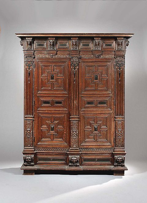 A Flemish Oak and Ebonised Cupboard