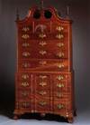 CHIPPENDALE CARVED AND FIGURED MAHOGANY BLOCK-FRONT CHEST ON CHEST