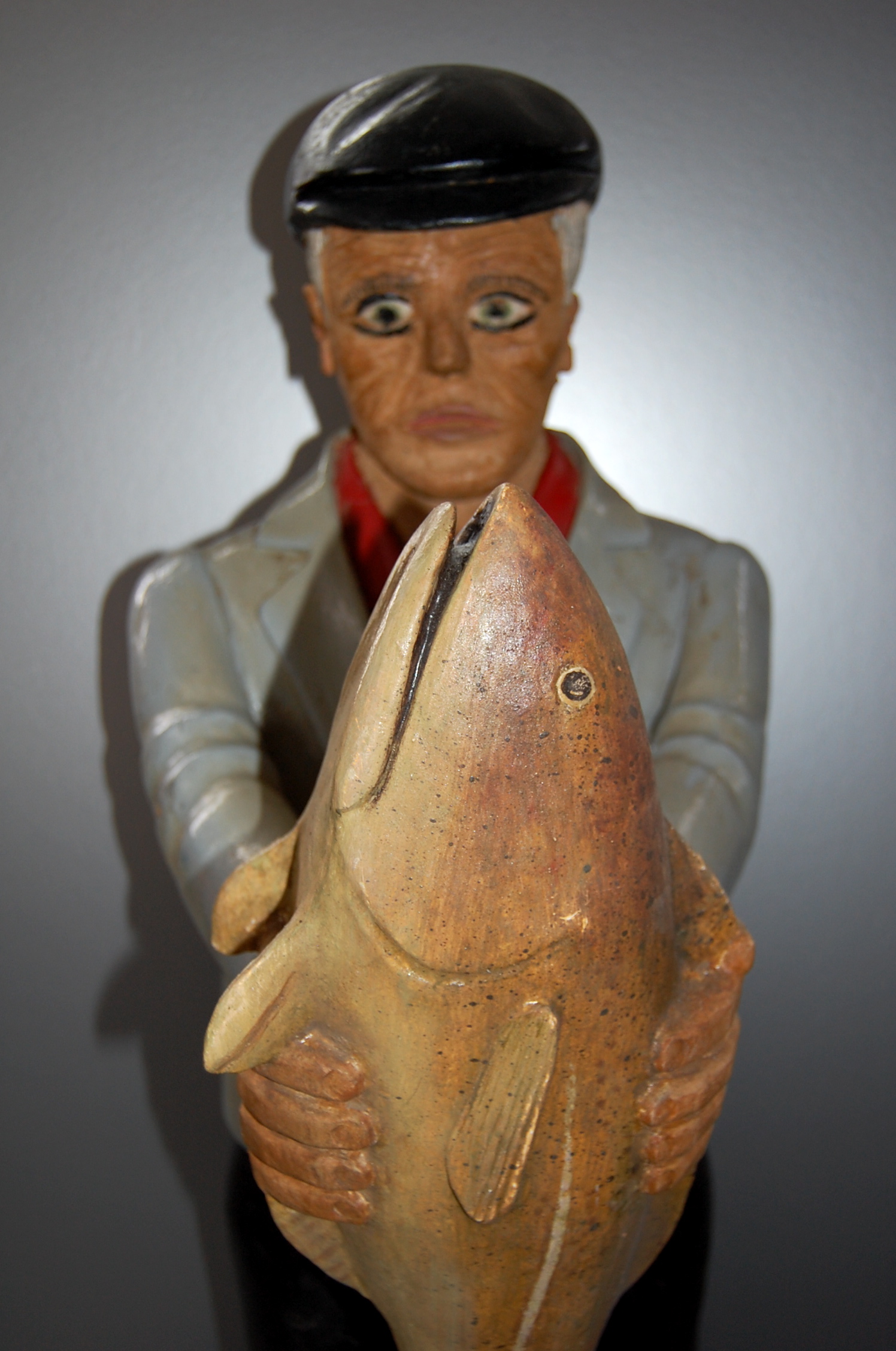 Carved man with fish