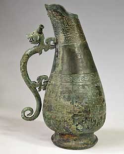 Hu Ewer with Dragon-shaped Handle, Bent Neck, and Beast-mask Design 1990 Western Zhou (ca. 1050–771 BCE) or Spring and Autumn period (770–476 BCE) Bronze. H 14.96, Diam 2.95 (at mouth), Diam. (at bottom) 4.53 in Unearthed in 1990 at Feixian Bridge, Xinning Xinning County Cultural Relics Administration  