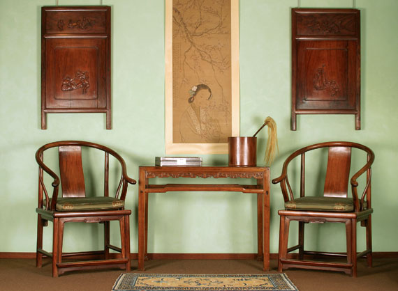 A Pair of Huali Horseshoe Chairs