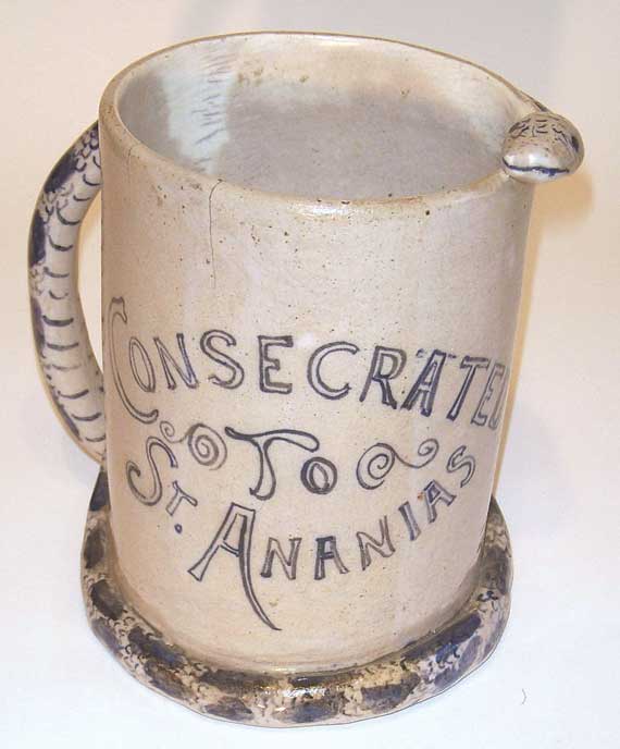 A Rare Salt Glazed Stoneware Mug with a Snake Handle and Cobalt Blue Decoration