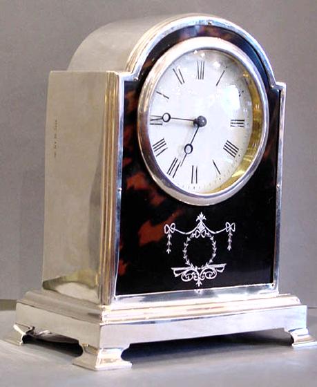 A Silver & Tortoiseshell Dome Top Mantel clock