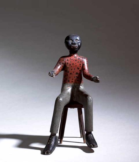 Carving of a Seated Black Man