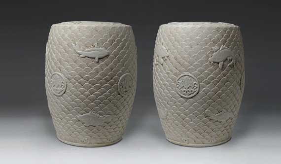 A Pair of Fine-Carved Blanc-de-Chine Stools Decorated with Fish Swimming in Stylized Waves