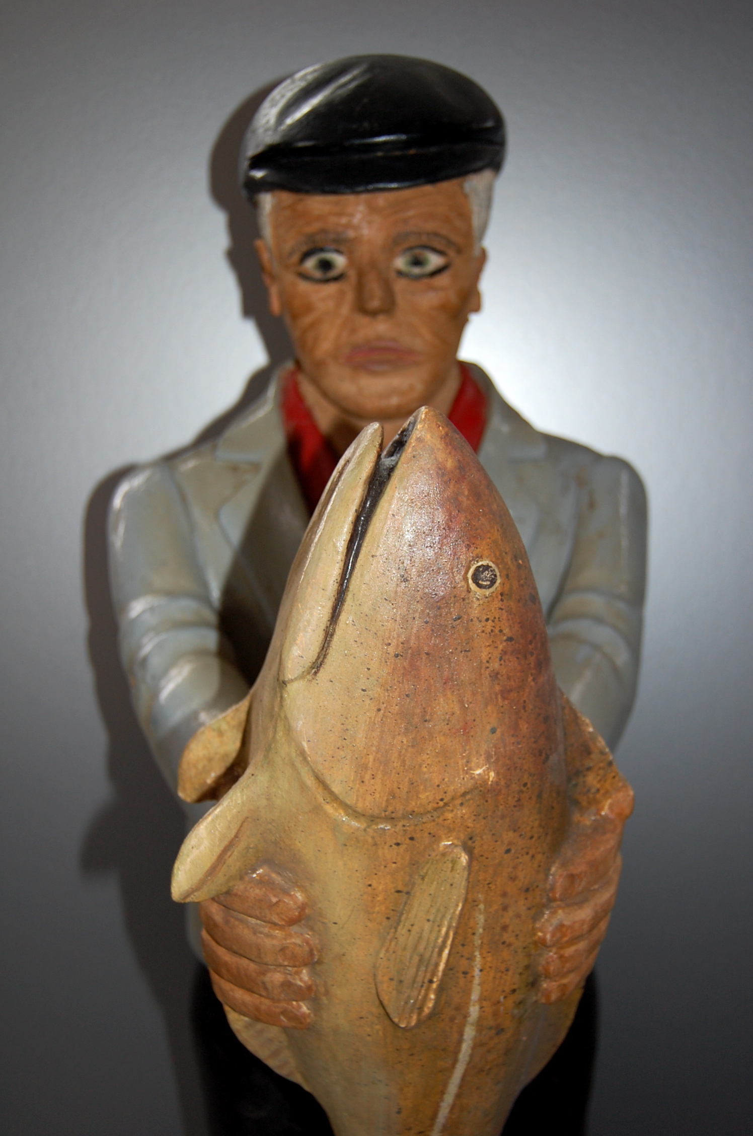 Carved man with fish